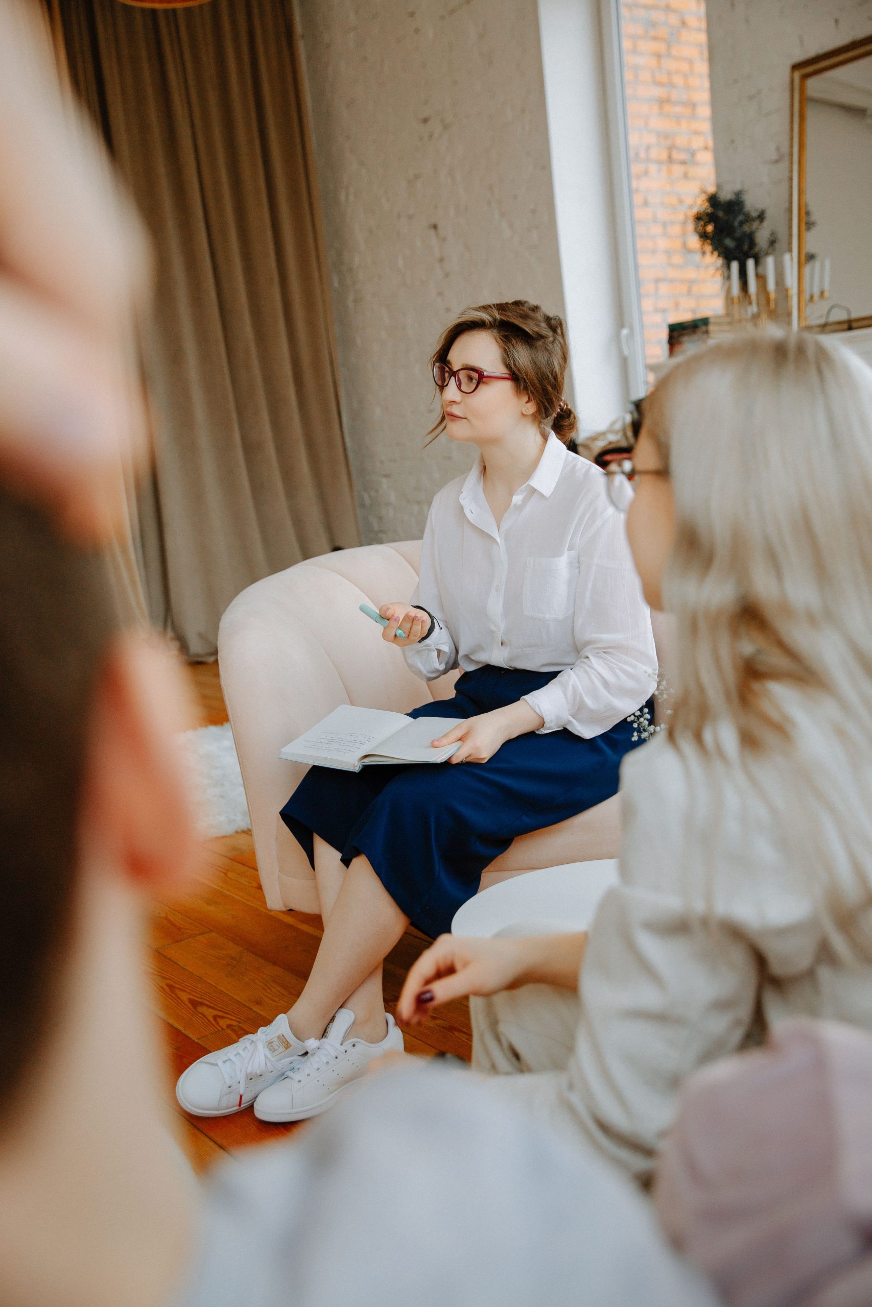 A professional woman with glasses with a couple